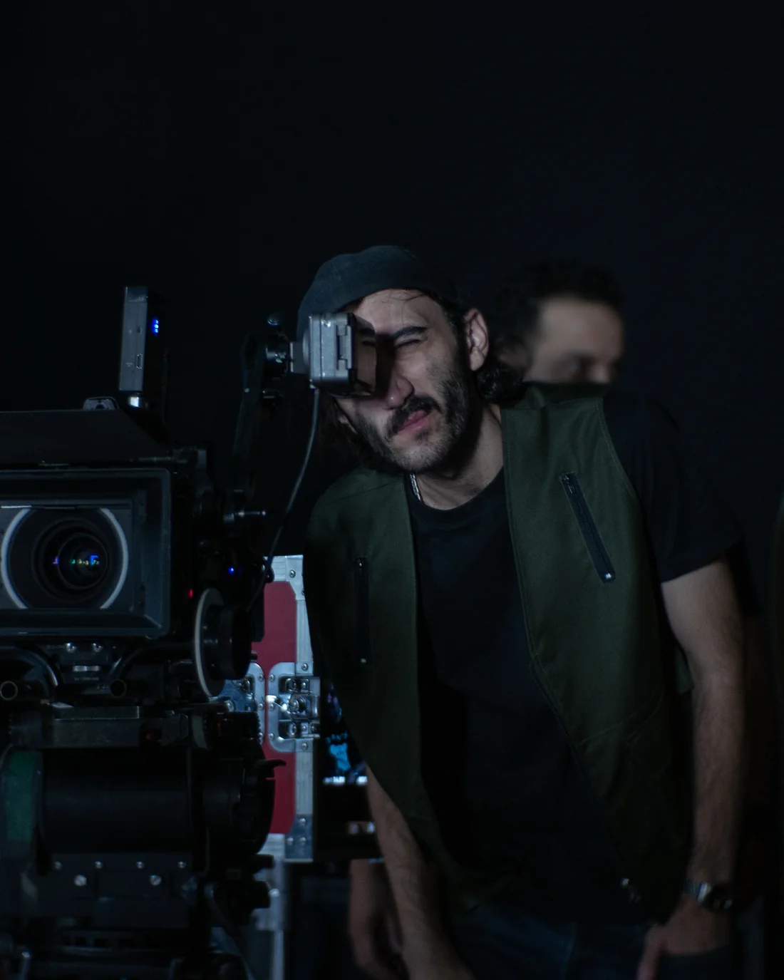 Hossein Nili at the camera eyepiece on a darkened set