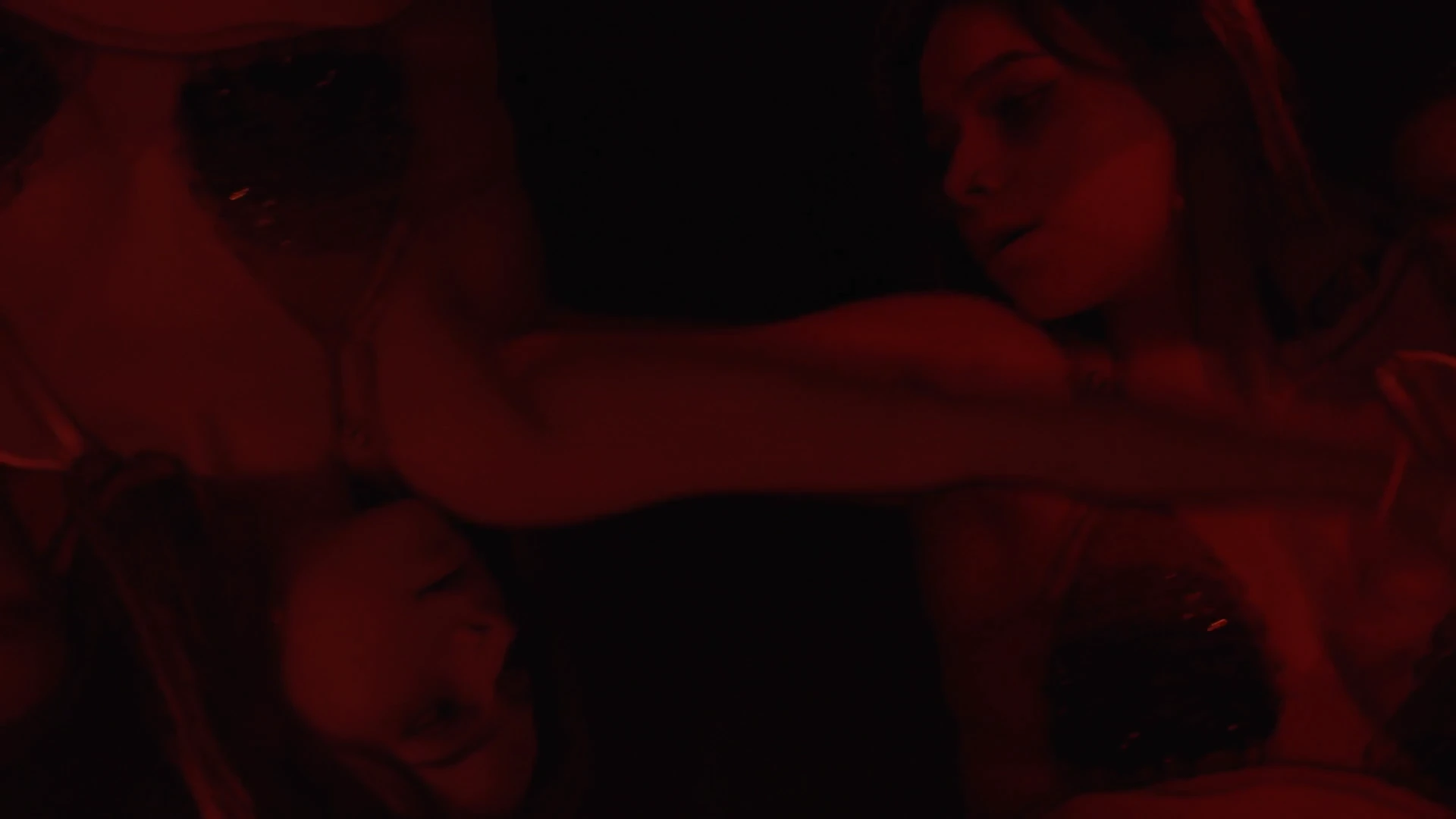 Intimate red-lit scene, Behind the Concrete Wall