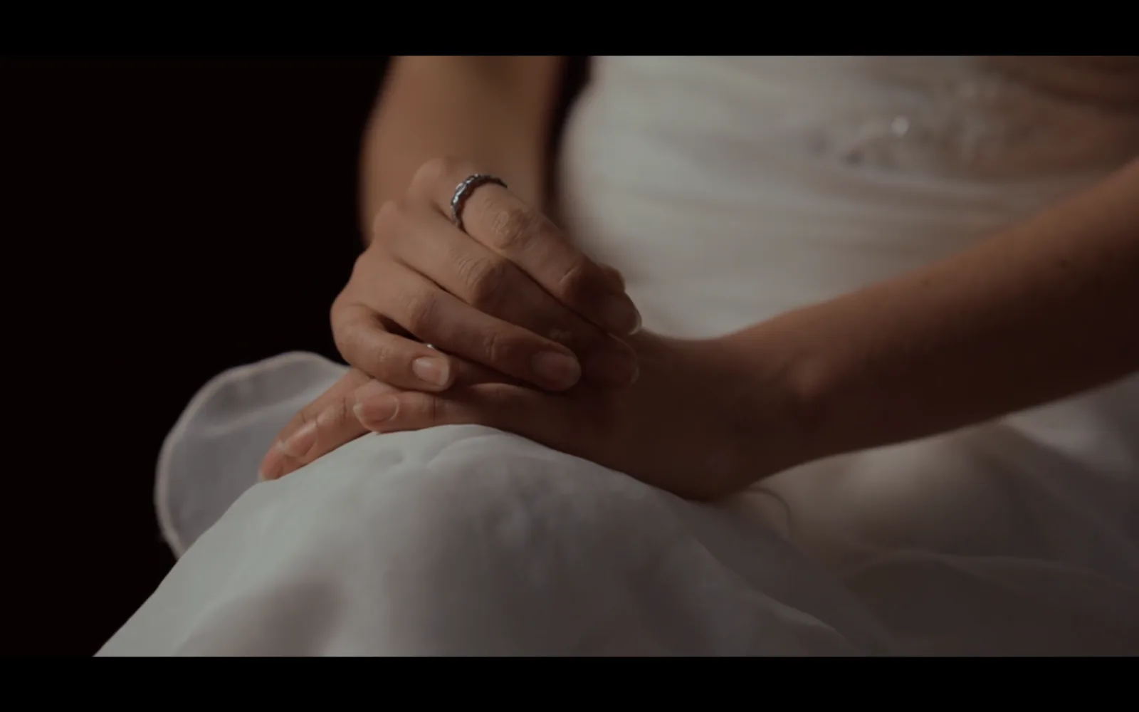 Hands and white fabric detail, Bride of Stolen