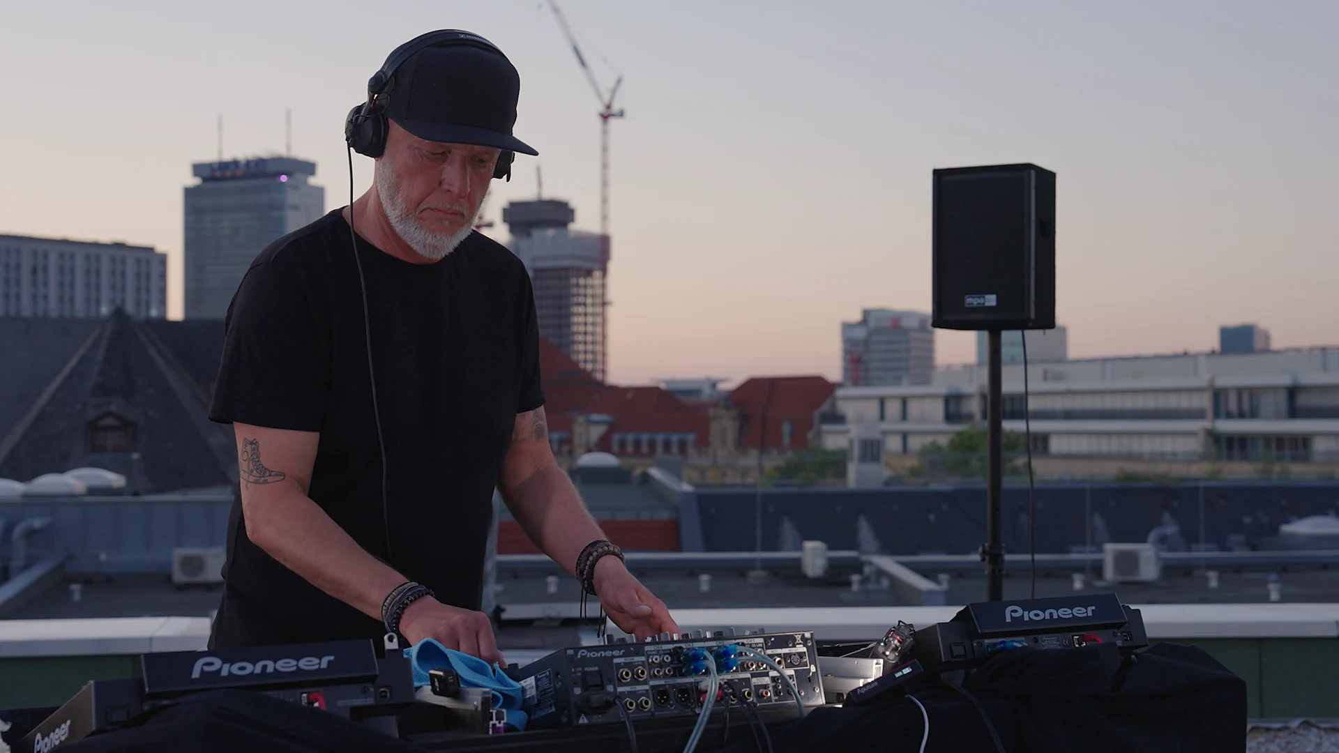 DJ over the decks, golden light, Live Music Set